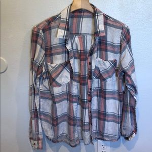 worn pink blue and white flannel